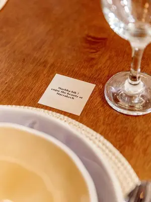 a table with a plate and a wine glass at Appartement confortable au cœur de Gueliz in Marrakech