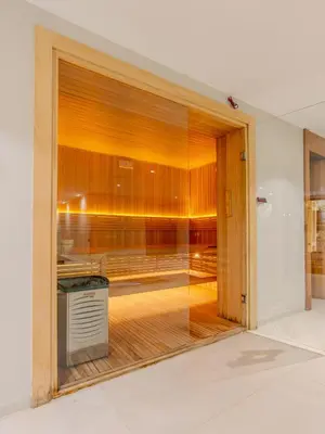 an open door to a kitchen with wooden walls at Villa Illao 2 Pool, Jacuzzi & Cinéma in Marrakech