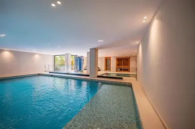a swimming pool in the middle of a house at Villa Illao 2 Pool, Jacuzzi & Cinéma in Marrakech