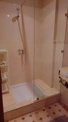 a shower with a glass door in a bathroom at Appartement Majorella Gueliz in Marrakech