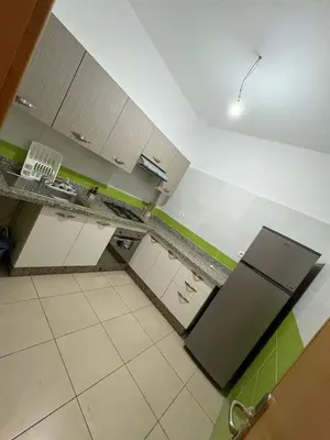 an overhead view of a kitchen with a refrigerator at Les Amandiers in Marrakech