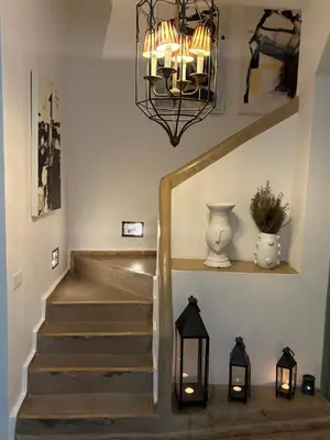 a staircase with a chandelier and some lights at Riad 29 Mouassine in Marrakech