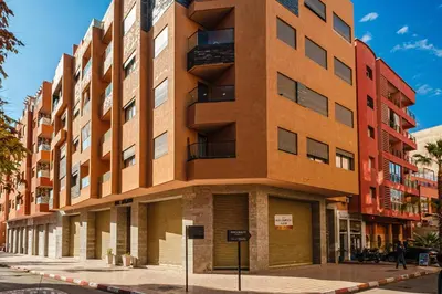 an apartment building on a city street at Chill Repeat Designer 2BR 2BA In Central Gueliz in Marrakech