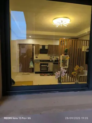a view of a kitchen through a window at Appartement moderne au cœur de Marrakech in Marrakech
