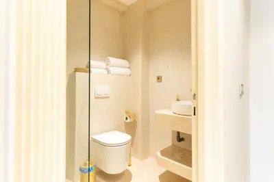 a bathroom with a toilet and a sink at Central apartment plus jacuzzi in Marrakech