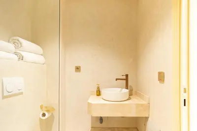 a bathroom with a sink and a shower at Central apartment plus jacuzzi in Marrakech
