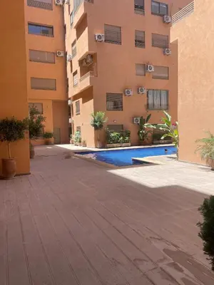 an empty courtyard in front of a building at Appartement moderne à louer Marrakech in Marrakech