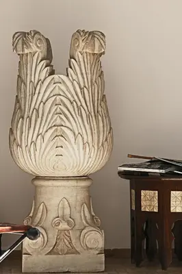a large white vase sitting next to a piano at Dar Mo'Da in Marrakech