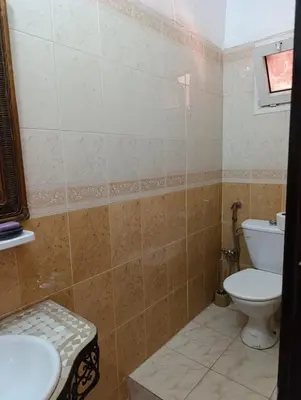 a bathroom with a toilet and a sink at Riad kech residence al Qarya syahiya Marrakech in Marrakech