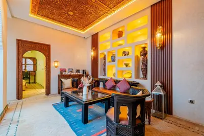 a living room with a couch and a table at Taj Riad Zitoune in Marrakech