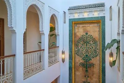 a hallway with a door with a design on it at Taj Riad Zitoune in Marrakech