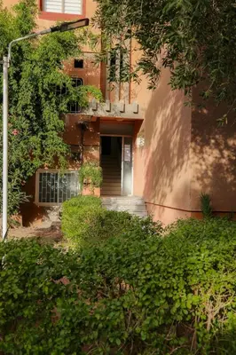 an outside view of a building with a door at Stylish YSL Street 2-BDR, parking, hi speed wifi in Marrakech