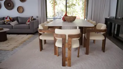 a living room with a wooden table and chairs at Luxury Villa 4 Bedrooms with Big Pool 5km from Medina in Marrakech