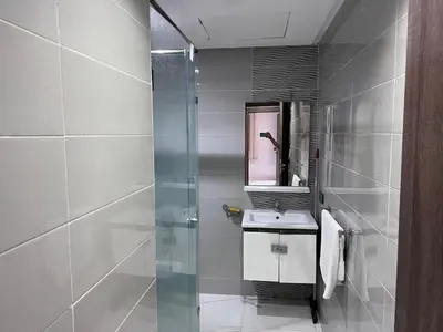 a bathroom with a sink and a shower at Appartement chic & elegant in Marrakech