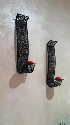 two black vases hanging on a wall at Marrakech Luxury Apartment with Pool & gym in Marrakech