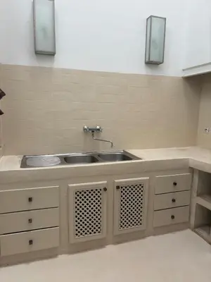 a kitchen with a sink and a counter at Riad Elena l Private Riad with heated Pool in Marrakech l 3 rooms in Marrakech