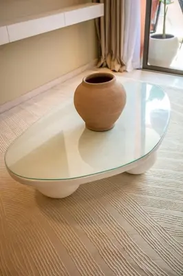 a vase sitting on top of a glass table at Luxury apartment near to McDonald's in Marrakech