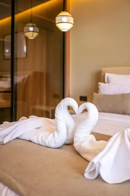 two swans making a heart on a bed at Luxury apartment near to McDonald's in Marrakech
