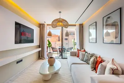 a living room with a couch and a table at Luxury apartment near to McDonald's in Marrakech