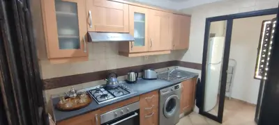 a small kitchen with a stove and a sink at Atlas Golf Resort - Marrakech palmeraie a 6 k m du centre in El Mgassem