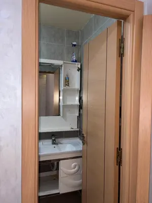 a bathroom with a sink and a mirror at Appartement 85m dans un quartier calme in Marrakech