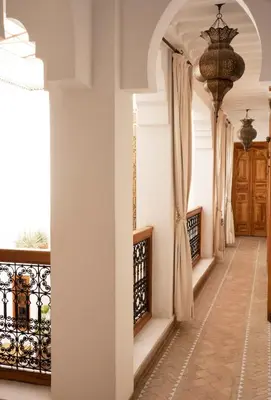 a hallway of a house with a balcony at Riad RK Suites & Spa in Marrakech