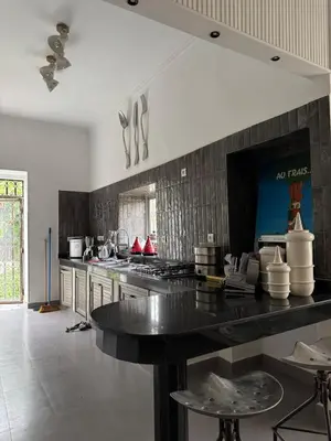 a kitchen with a large counter top in a room at Villa en centre Ville de Marrakech, 5 Chambres, Piscine, Rooftop in Marrakech