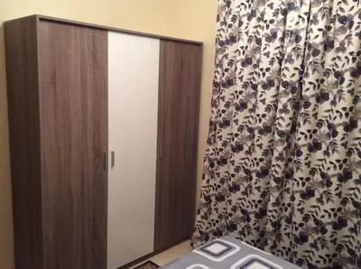 a bedroom with a sliding door and a curtain at Apartment Majdoline in Marrakech