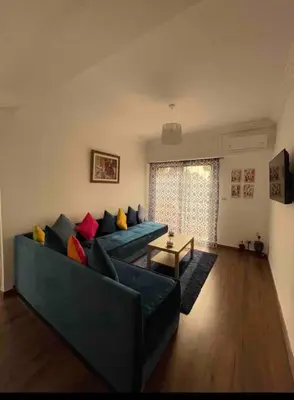 a living room with a couch and a table at Blue Majorelle in Marrakech