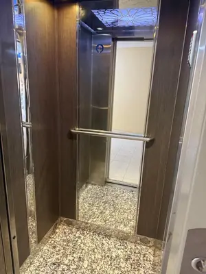 a glass shower with a glass door in a bathroom at Apparemment à Marrakech in Marrakech