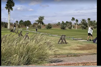 a group of people playing golf in a park at Appartement XXL résidence privée piscine Dar Dmana PALMERAIE in Marrakech