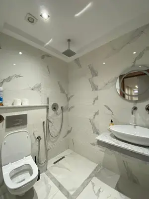 a bathroom with a toilet and a sink at Studio Jasmine in Marrakech