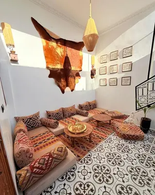 a living room with a couch and a table at Dar Skouri in Marrakech