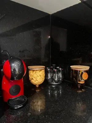 a red blender sitting on top of a counter at Garden level & pool, cozy apartment queen size bed in Marrakech