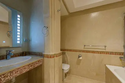 a bathroom with a sink and a toilet at Appartement Confort - Hivernage - Piscine in Marrakech