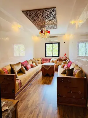 a large living room with couches and a chandelier at Marrakech Soft Escape in Marrakech