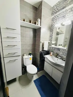 a bathroom with a toilet and a sink and a mirror at Marrakech Soft Escape in Marrakech
