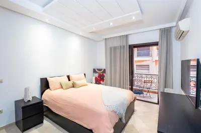 a bedroom with a bed and a window at La Perle - Semlalia Gueliz - 2 Prs - Balcony in Marrakech