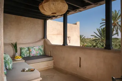 a room with a bench and a large window at Villa Monica in Marrakech