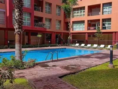 a swimming pool in front of a building at Gueliz 3BR 3BA Duplex Pool & Balcony Majorelle in Marrakech