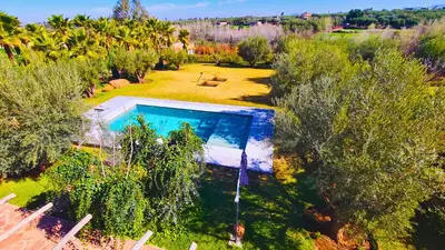 an overhead view of a swimming pool in a garden at Villa Deneb - secret garden, swimming pool and starry sky in Marrakech