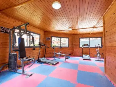 a gym with several exercise equipment in a room at Beautiful apartment in Premium Village Marrakech in Marrakech