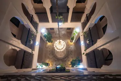 an overhead view of a building with a chandelier at Riad azzouina in Marrakech