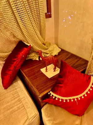 a table with red pillows on top of a couch at Beldi Luxury apartment near M Avenue with Free Parking in Marrakech