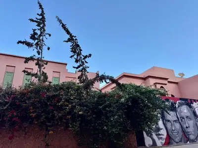 a building with a mural of faces on it at Beldi Luxury apartment near M Avenue with Free Parking in Marrakech