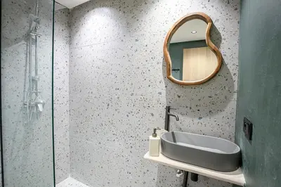 a bathroom with a sink and a mirror at Nova Collection - Hivernage Marrakech in Marrakech