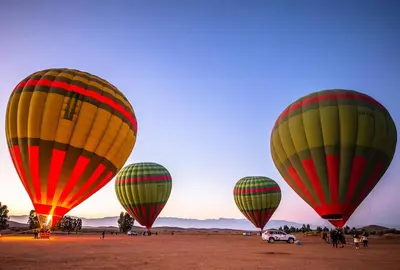 a group of hot air balloons in a field at Nova Collection - Hivernage Marrakech in Marrakech