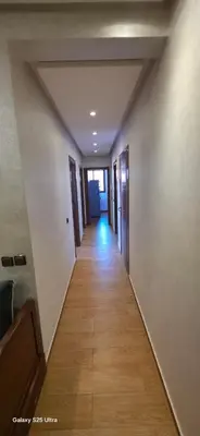 a hallway with a long corridor with a hallway at Nizar 1 in Marrakech