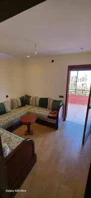 a living room with a couch and a table at Nizar 1 in Marrakech