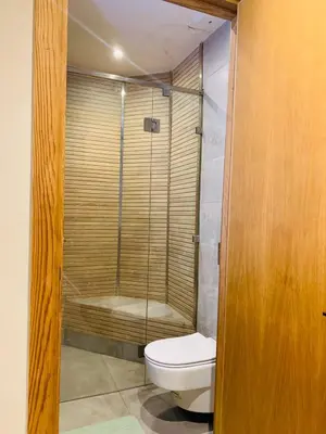 a bathroom with a toilet and a shower at 1 bedroom apartment Miramas 2, gueliz in Marrakech